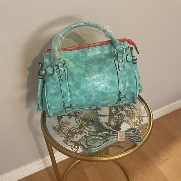 Turquoise large faux leather handbag with tassel accents. - Picture 2 of 4